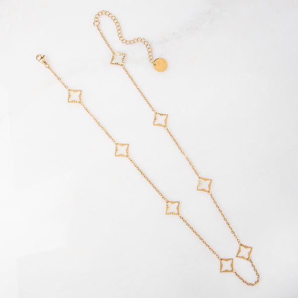 Addie Necklace - Ella Lane Stainless steel gold star cut outs on chain. 18 - 20.75 adj.