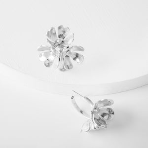 Enya Earrings - Ella Lane Silver flowers on a silver hoop. 1.5” 0.9 oz.