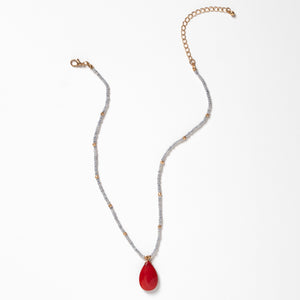 Estelle Necklace - Ella Lane Light gray seed bead necklace with red teardrop pendant and gold accents. Natural stone –