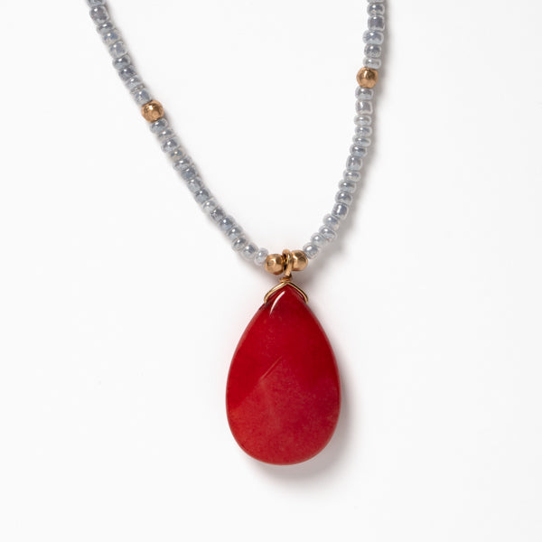 Estelle Necklace - Ella Lane Light gray seed bead necklace with red teardrop pendant and gold accents. Natural stone –