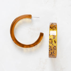 Camilla Rae Earrings - Ella Lane Fabulous leopard print acrylic hoops. Print will vary. 1.75 0.243 oz.